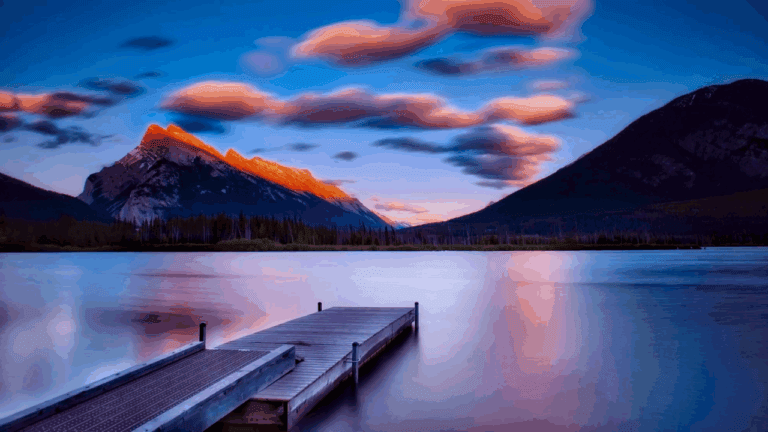 Sun setting over a lake and dock